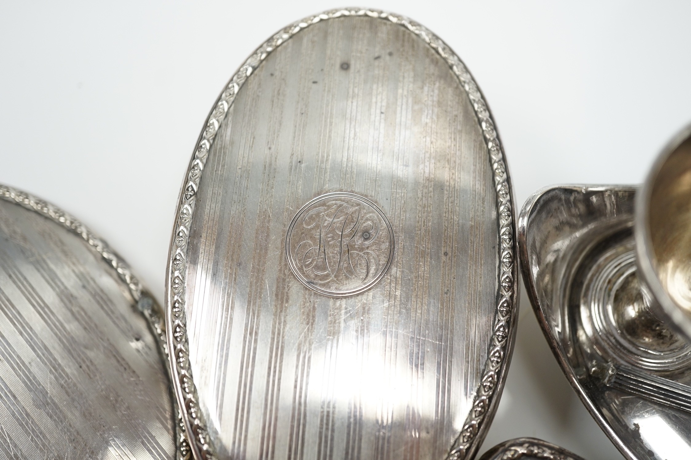 A late Victorian silver egg cruet, Martin, Hall & Co, Sheffield, 1889 (a.f. and lacking spoons), 12.3oz, and a later four piece silver mounted mirror and brush set.
